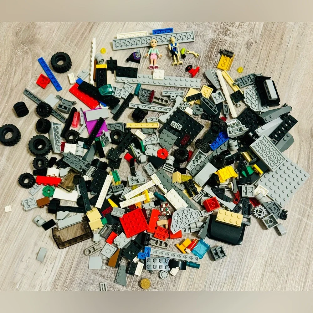 0.697 lbs. Net weight of small Lego bricks. Various parts and pieces. There are